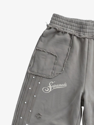 Asymmetrical Logo Embroidered Pants