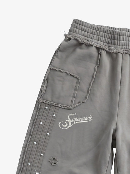 Asymmetrical Logo Embroidered Pants